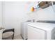 Laundry room with washer, dryer, and shelving at 664 Benoi Dr, Davenport, FL 33896