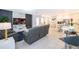 Open concept living and kitchen area with modern decor at 664 Benoi Dr, Davenport, FL 33896