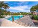 Community pool with lounge area at 664 Benoi Dr, Davenport, FL 33896