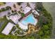 Resort-style pool with surrounding lounge chairs and landscaping at 664 Benoi Dr, Davenport, FL 33896