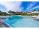 Resort-style pool with lounge chairs and umbrellas at 664 Benoi Dr, Davenport, FL 33896
