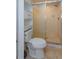 Bathroom includes a toilet, shower, and shelving unit at 6928 Sugarbush Dr, Orlando, FL 32819