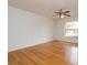 Bright bedroom features hardwood flooring and large windows at 6928 Sugarbush Dr, Orlando, FL 32819