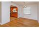 Dining room with hardwood floors and view of kitchen at 6928 Sugarbush Dr, Orlando, FL 32819