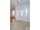 Bright entryway with tile flooring and an elegant stained-glass door at 6928 Sugarbush Dr, Orlando, FL 32819