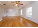Spacious living area with hardwood floors and ceiling fan at 6928 Sugarbush Dr, Orlando, FL 32819