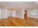 Open living and dining area with hardwood floors and neutral colors at 6928 Sugarbush Dr, Orlando, FL 32819