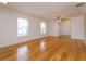Large living room featuring hardwood floors and ample natural light at 6928 Sugarbush Dr, Orlando, FL 32819