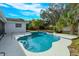 Relaxing kidney-shaped pool with surrounding patio at 6928 Sugarbush Dr, Orlando, FL 32819