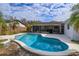 Kidney-shaped pool with concrete decking at 6928 Sugarbush Dr, Orlando, FL 32819