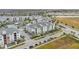 Aerial view of apartment community with pool, landscaping, and parking at 7517 Laureate Blvd # 4205, Orlando, FL 32827