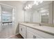 Double vanity bathroom with view of bedroom at 7517 Laureate Blvd # 4205, Orlando, FL 32827