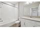 Clean bathroom with white cabinets and bathtub at 7517 Laureate Blvd # 4205, Orlando, FL 32827
