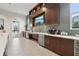 Modern community kitchen with wood cabinets and stainless steel appliances at 7517 Laureate Blvd # 4205, Orlando, FL 32827