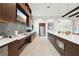 Modern kitchen with white countertops and wood cabinets at 7517 Laureate Blvd # 4205, Orlando, FL 32827