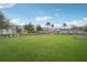 Community dog park with artificial turf and perimeter fencing at 7517 Laureate Blvd # 4205, Orlando, FL 32827