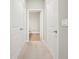 Bright hallway with access to bathroom and two rooms at 7517 Laureate Blvd # 4205, Orlando, FL 32827