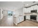 Modern kitchen with white cabinets, stainless steel appliances, and an island at 7517 Laureate Blvd # 4205, Orlando, FL 32827