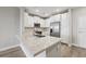 Modern kitchen with white cabinets and stainless steel appliances at 7517 Laureate Blvd # 4205, Orlando, FL 32827