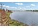 Scenic lake view with lush landscaping at 7517 Laureate Blvd # 4205, Orlando, FL 32827