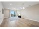 Spacious living room with tile floors and access to a balcony at 7517 Laureate Blvd # 4205, Orlando, FL 32827