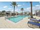 Stunning community pool with ample lounge chairs at 7517 Laureate Blvd # 4205, Orlando, FL 32827