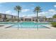 Beautiful community pool area with lounge chairs at 7517 Laureate Blvd # 4205, Orlando, FL 32827
