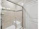 Large tiled shower with built-in seat at 7517 Laureate Blvd # 4205, Orlando, FL 32827