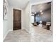 Bright entryway with tile flooring, leading to a home office at 8077 Chilton Dr, Orlando, FL 32836