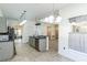 Open kitchen with island and view to dining area at 925 Balmoral Dr, Davenport, FL 33896