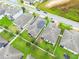Aerial view of homes with solar panels at 975 Benjamin Trl, Davenport, FL 33837