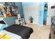 Bedroom with a bed, closet, and anime posters on the wall at 975 Benjamin Trl, Davenport, FL 33837