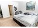 Bright bedroom with a large bed, plush carpet, and en-suite bathroom at 975 Benjamin Trl, Davenport, FL 33837