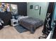 Bedroom with full-size bed and gaming chair at 975 Benjamin Trl, Davenport, FL 33837
