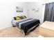 King-size bed in a spacious bedroom with neutral colors at 975 Benjamin Trl, Davenport, FL 33837