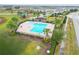 Community pool with adjacent playground and picnic area at 975 Benjamin Trl, Davenport, FL 33837