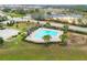 Community pool with a covered seating area at 975 Benjamin Trl, Davenport, FL 33837