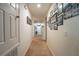 Hallway with Gathering photos and light walls, leading to other rooms at 975 Benjamin Trl, Davenport, FL 33837