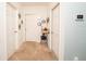 Bright hallway with neutral walls, carpet, and storage at 975 Benjamin Trl, Davenport, FL 33837