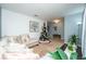 Living room with sectional sofa and holiday decor at 975 Benjamin Trl, Davenport, FL 33837