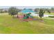 Community playground with shade structure and play equipment at 975 Benjamin Trl, Davenport, FL 33837