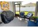 Relaxing screened patio with wicker furniture at 975 Benjamin Trl, Davenport, FL 33837