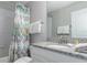 Bathroom with shower/tub combo and granite countertop at 1550 Observer Ln, Davenport, FL 33896