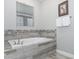 Relaxing bathroom with a soaking tub at 1550 Observer Ln, Davenport, FL 33896