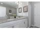 Elegant bathroom with double vanity and granite countertops at 1550 Observer Ln, Davenport, FL 33896
