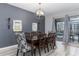 Formal dining room with dark wood table and floral chairs at 1550 Observer Ln, Davenport, FL 33896