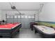 Fun game room with pool table, foosball, and air hockey at 1550 Observer Ln, Davenport, FL 33896