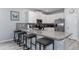 Modern kitchen with stainless steel appliances and granite countertops at 1550 Observer Ln, Davenport, FL 33896