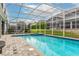 Inviting screened pool and spa with plenty of space for lounging at 1550 Observer Ln, Davenport, FL 33896