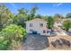 Rear view of a single-story house with a large backyard at 1733 Hickorywood Ln, Orlando, FL 32818